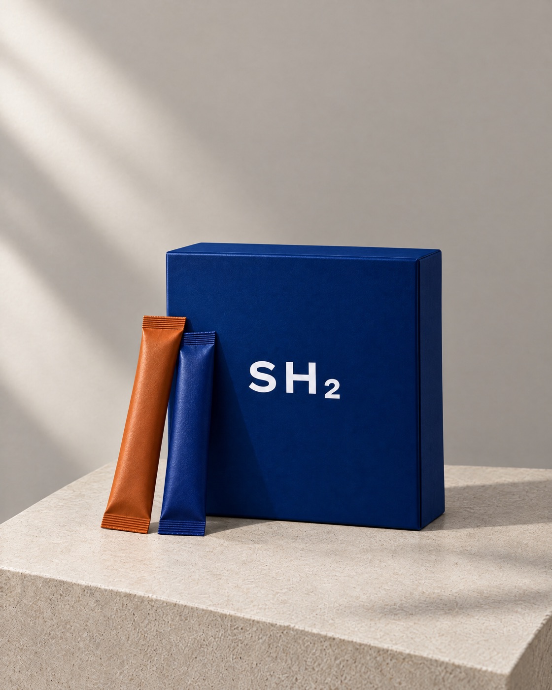 The closed cobalt SH2 box with a morning stick and a night stick leaning against it